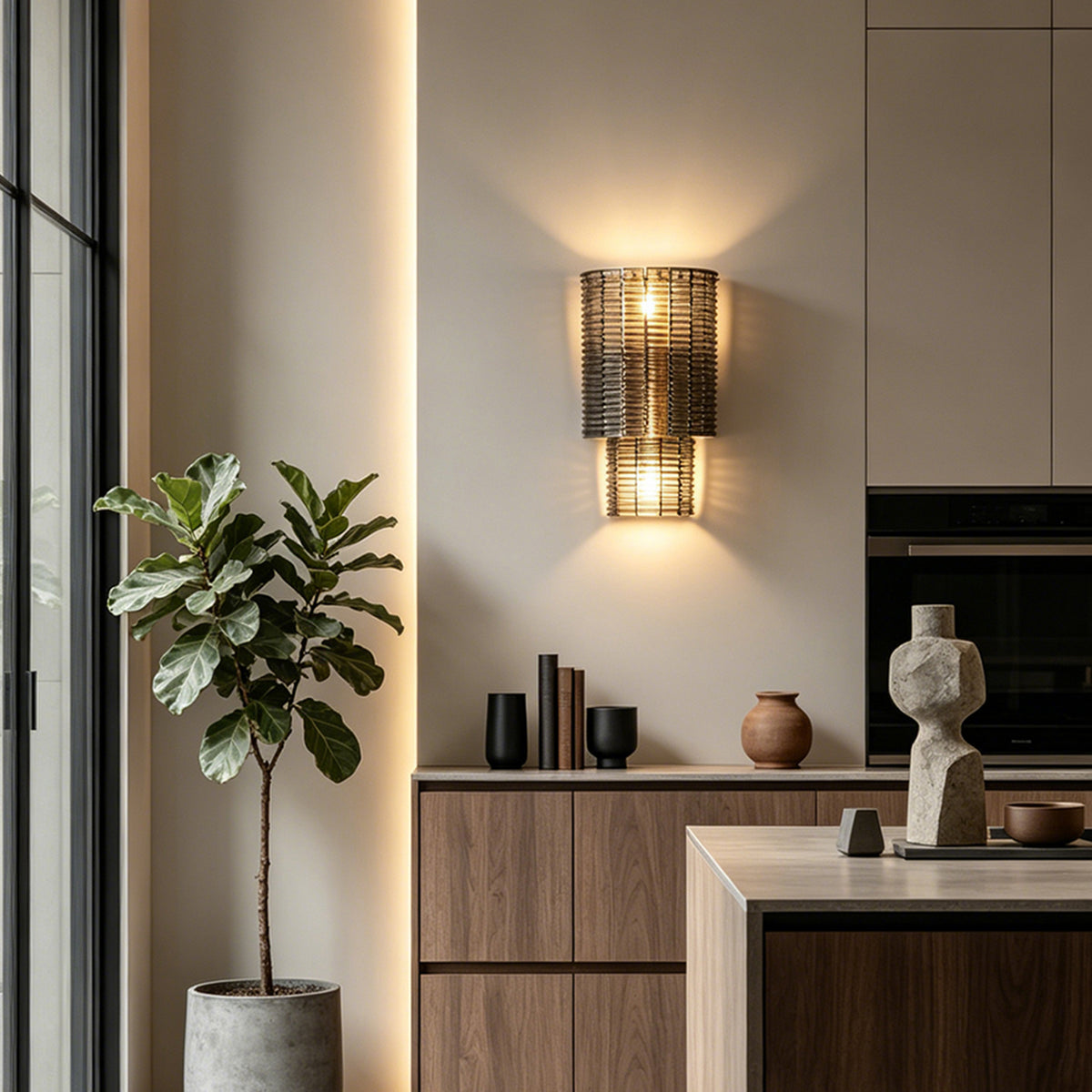 Vespera Tiered Smoky Glass Wall Lamp | Glass, Metal | Providing cozy ambient illumination on an accent wall in a sleek modern kitchen transition space with wooden cabinets | Severn Lighting