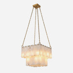 Vivienne Tiered Alabaster Chandelier | Alabaster, Brass | Isolated lit view of a luxury multi-tiered rectangular square chandelier featuring rows of natural white translucent alabaster stone tiles suspended by gold brass chains | White background | Severn Lighting